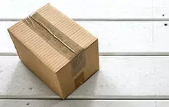  2021/10/box-front-porch-245.jpg Cardboard delivery parcel box delivered to doorstep closeup