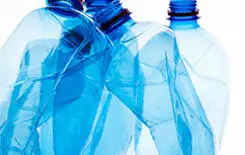  2021/10/mineral-water-bottles-crushed-245.jpg Mineral water bottles crushed and crumpled against white isolated background, panorama, copy space