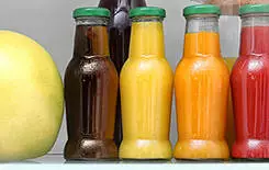  2021/10/refrig-245.jpg Drinks, vegetables and fruit on refrigerator shelves, closeup