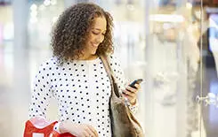  2021/10/woman-shopping-mobile-42307283-245.jpg Woman In Shopping Mall Using Mobile Phone