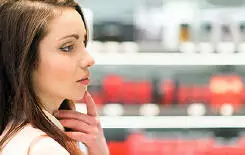  2021/10/young-woman-shopping-decision-245.jpg Young woman shopping in a beauty shop