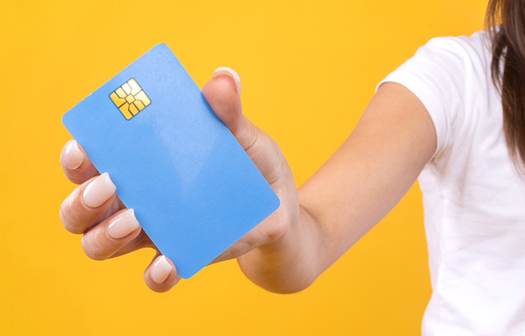 Close-up of woman's hand holding a credit card