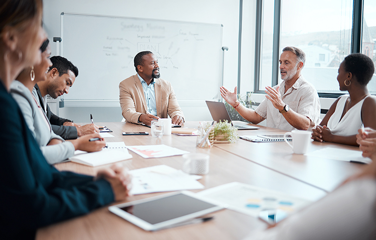 Photo of a business team meeting and setting strategy 