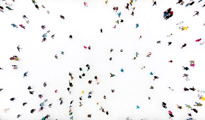 Aerial drone view of many people on an outdoor skating rink