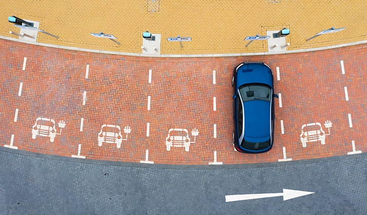 Aerial view of an electric car charging station with parking spots
