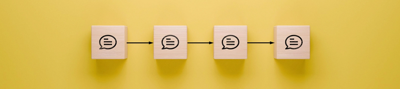 Communication flow and feedback loop concept illustrated with wooden blocks