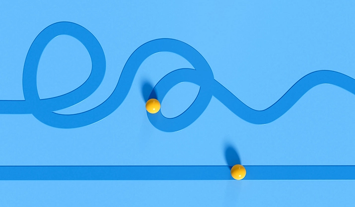 Illustration of two yellow spheres, each moving along a curvy path and a straight path.