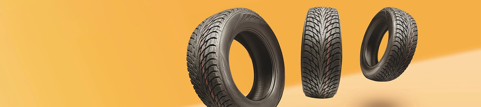 three tires on an orange background