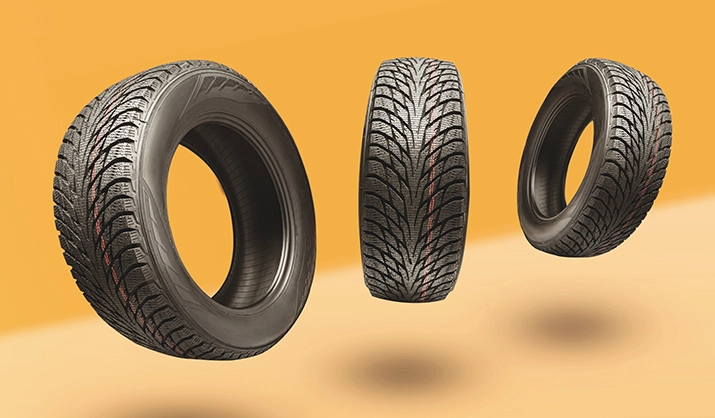 three tires on an orange background