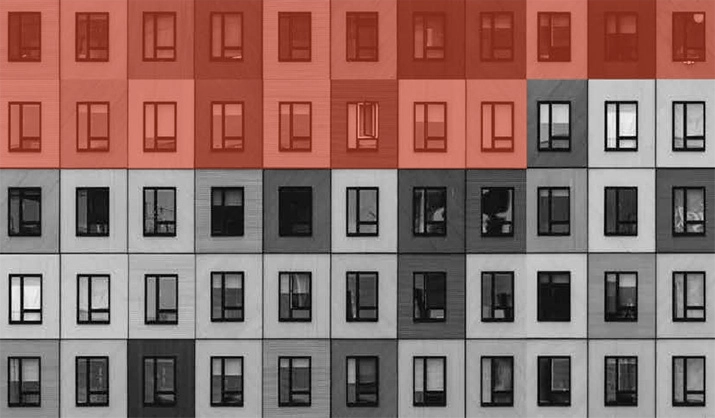 Image of an apartment building with many windows