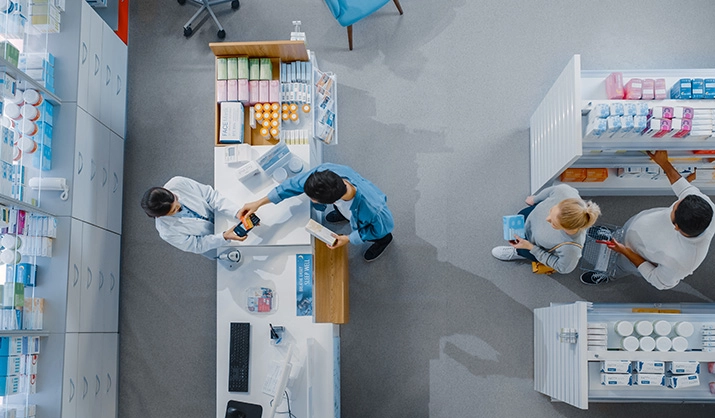 Overhead view of customers in a pharmacy