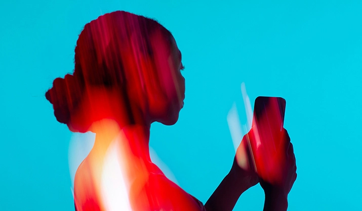 Photo illustration of a tech consumer using mobile device